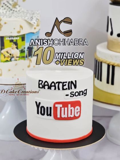 A custom YouTube-themed cake celebrating 10 million views for musician Anish Chhabra's song "Baatein."