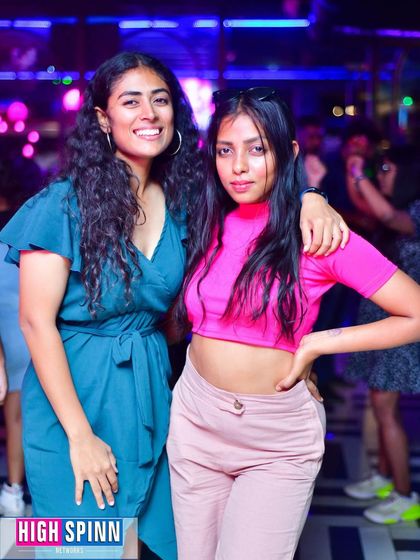 Friends enjoying a night out at Drava. The colorful lighting and upbeat music make for a great party.