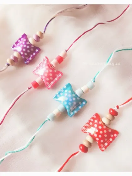 Sweet like candy. These polka dot pillow-bead Rakhis are a fun and unique option for kids. They come in a variety of bright colors and are super lightweight.