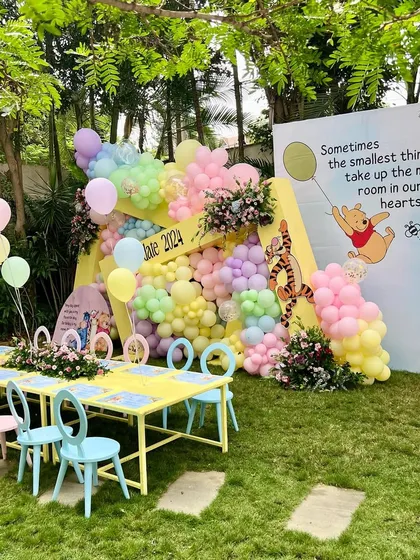 We believe even playdates can be magical. For this Winnie the Pooh themed gathering, we set up adorable kid-sized tables and chairs in a garden, complete with a colorful pastel balloon backdrop and a quote from the classic story.