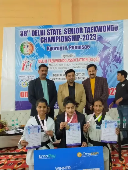 Komal on the podium after winning a bronze medal in the senior category at the 38th Delhi State Championship.