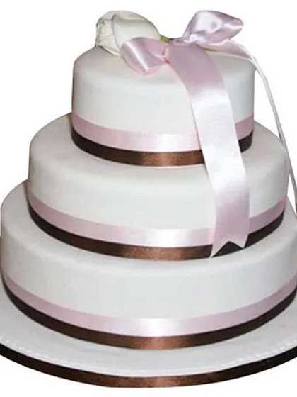 We create elegant multi-tiered cakes for your grand celebrations like weddings, engagements, or milestone anniversaries. This three-tier fondant cake shows a clean, classic design that can be customized for any large event.