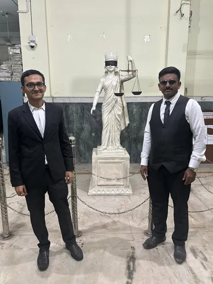 With a colleague in front of the statue of Lady Justice. This symbol reminds me every day of my commitment to truth and fairness in my legal practice.