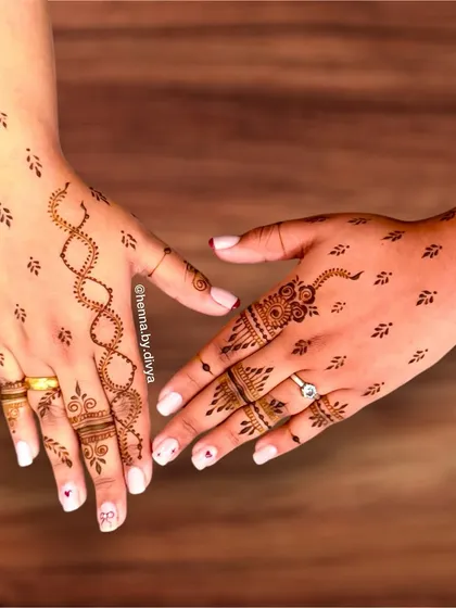 For a truly unique and minimal look, I created this design featuring a DNA-like helix pattern on one hand and scattered leaf motifs on both. It's a contemporary and personal style statement.