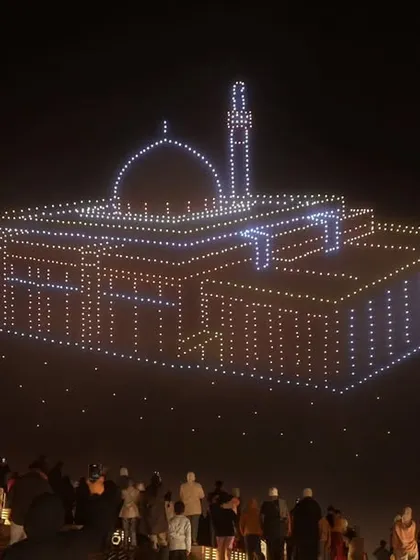 A grand mosque formation illuminates the sky at the Ya Hala Festival in Kuwait. Our shows blend seamlessly with local culture, creating respectful and breathtaking tributes.