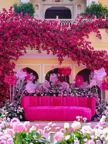 Drenched in 'gulabi' glam. This explosion of bougainvillea against a heritage palace backdrop was for a Mehendi that was anything but ordinary. It’s a whole vibe, a floral fantasy brought to life.