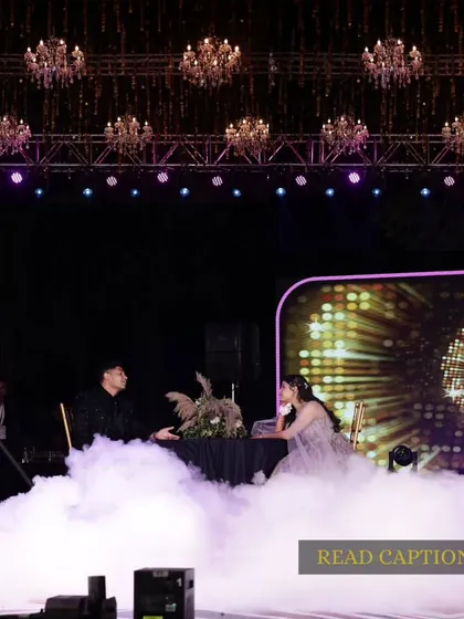 It's all in the details. We create entire narratives for your sangeet, like this romantic date scene complete with a table set amidst clouds of smoke, perfectly capturing the "kuch kuch hota hai" feeling.
