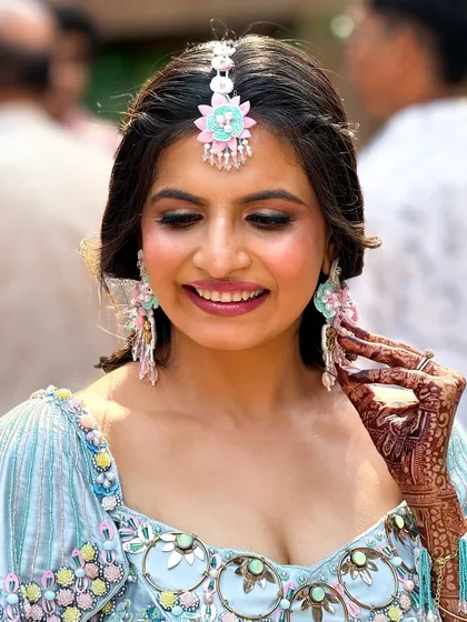This shot highlights the beautiful, custom floral jewelry and the makeup that complements it perfectly.