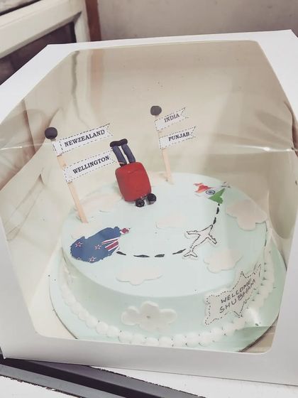 Our travel-themed cake, all packed up and ready to go to its new home.
