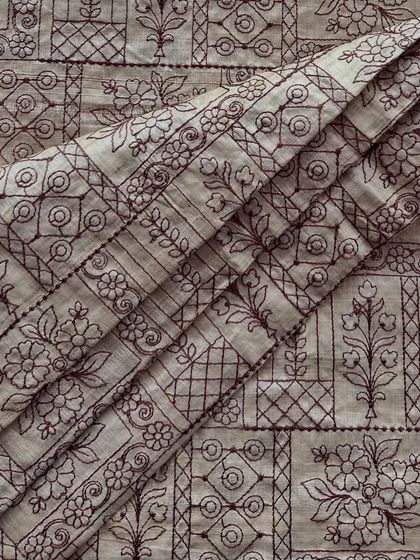 Our embroidered Tussar silk, with its detailed panel design, offers a unique blend of rustic texture and refined elegance. It's perfect for creating structured jackets or statement kurtas.