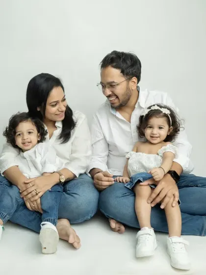 A candid moment of interaction during the family photoshoot. These natural smiles are the best.