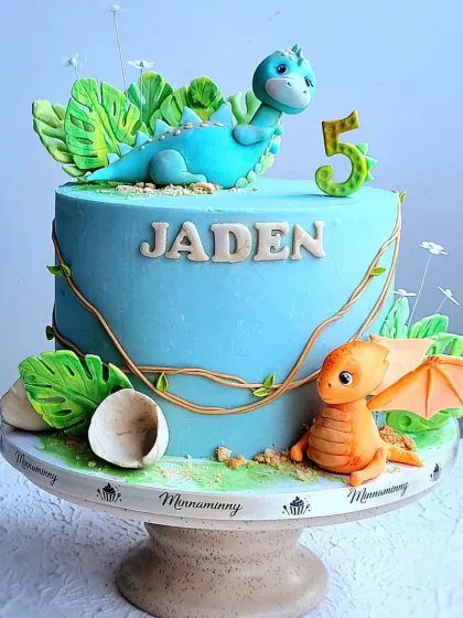 Another angle of the dinosaur cake, showing how the fondant vines wrap around the side.