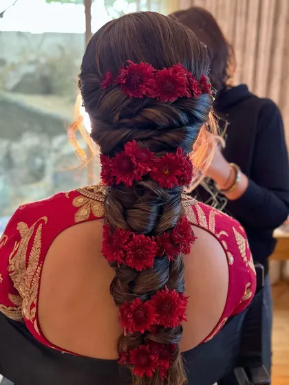 Another angle of the festive red floral braid, a perfect statement for a winter bride.