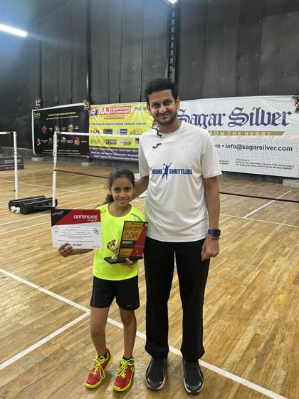Kashvi with her coach after winning the girls' under-9 category at the Open Mumbai Suburban District Tournament. The coach-student relationship is central to our success.