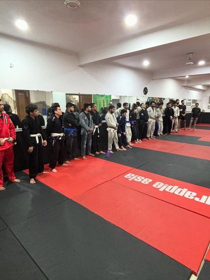 Lined up and ready to learn. Our members listening intently during a Jiu-Jitsu seminar with a guest professor. We are always students of the art, constantly seeking knowledge.