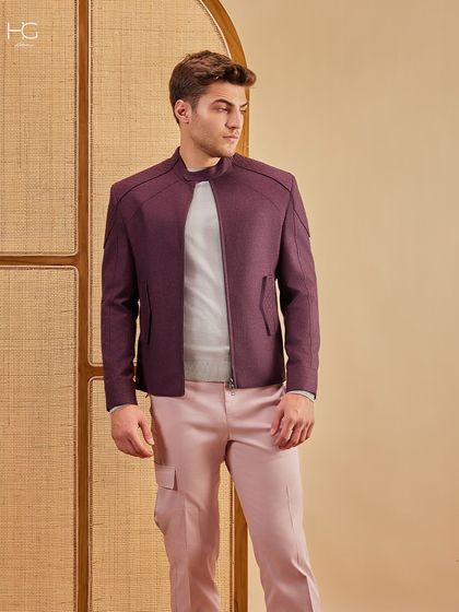 A full-length view of the maroon shacket and pink trousers, a color story that is both intentional and sophisticated.