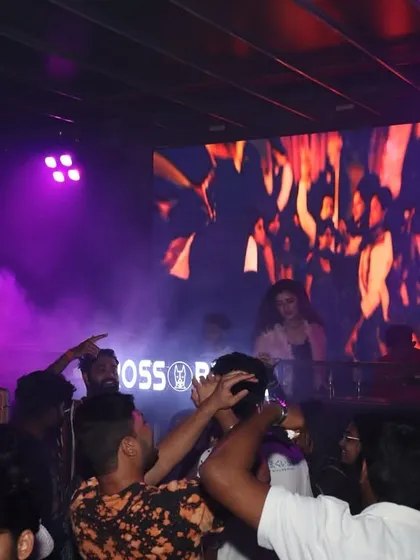 The crowd at Crossbreed, Hyderabad, enveloped in smoke and lights, creating a mystical party atmosphere.
