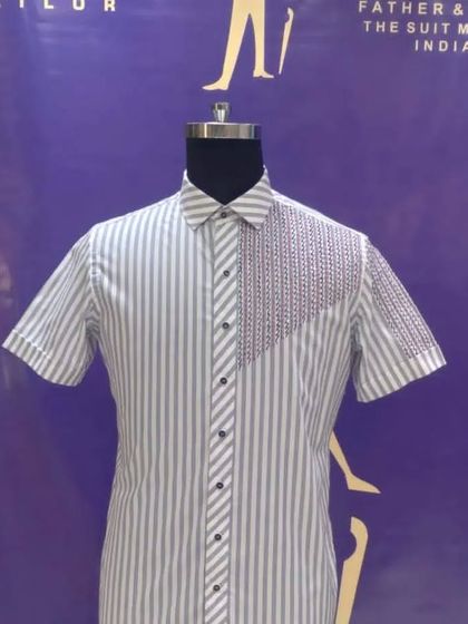 A custom striped half-sleeve shirt with an embroidered panel. This is a great example of how we can mix patterns and textures to create a unique design.