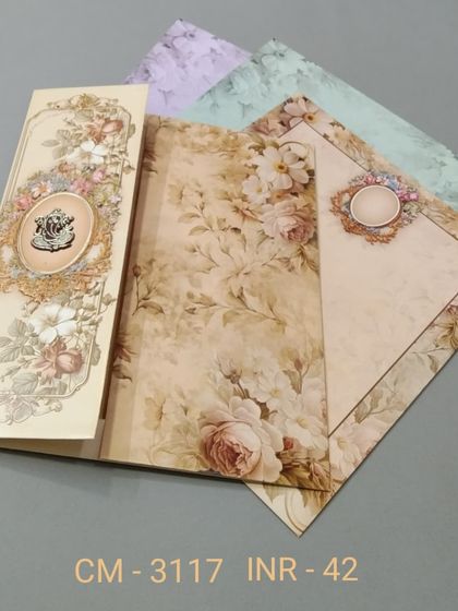 This vertical invitation set features a vintage floral pattern in soft, muted tones. The design is elegant and timeless, with inserts in various coordinating colors.