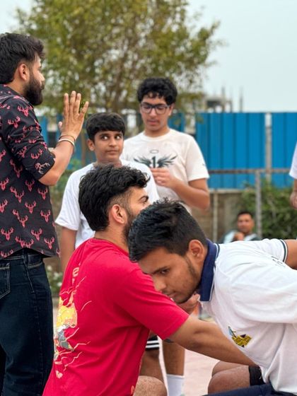 A team huddle during a break. We win as a team and we learn as a team.