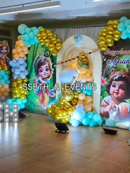The full view of our grand Little Krishna themed event decor. The illuminated marquee letters for 'Ayaansh' add a modern touch to the traditional theme and look great in photos.