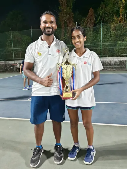 Lucy (Tuhina) Roy with her coach after winning the All India Championship Series Under 14 Doubles title in Mumbai.