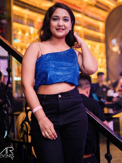 A guest posing on the stairs.