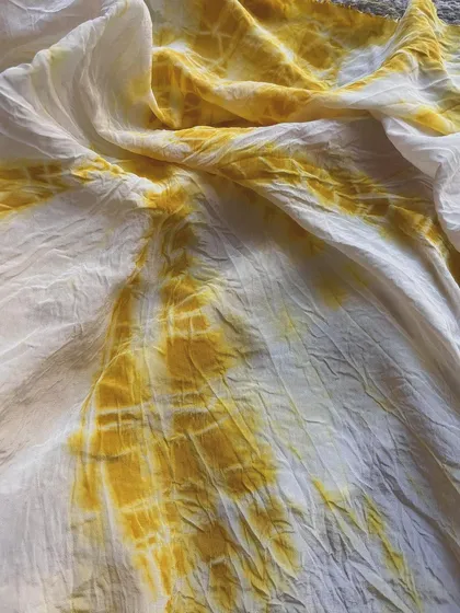 This vibrant yellow was achieved on mulberry silk using turmeric powder. With the right mordant, which helps fix the color, this natural dye stays bright and lasts forever with simple care. It's a beautiful example of creating permanent color from kitchen ingredients.