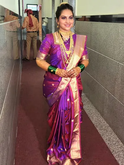 Another look at the bride's Nauvari drape, showing how the saree is styled from the front. This is a different style of Nauvari, showcasing the versatility within this traditional drape.