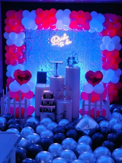 Here, the "Bride to be" setup is illuminated with cool blue lighting, creating a stylish, club-like vibe for a fun party with friends before the big day.