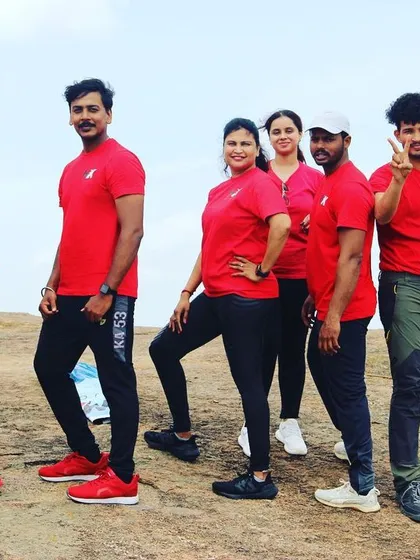 Posing for a group photo on the rocks of Shivagange. It's all about capturing the memories and enjoying the camaraderie.