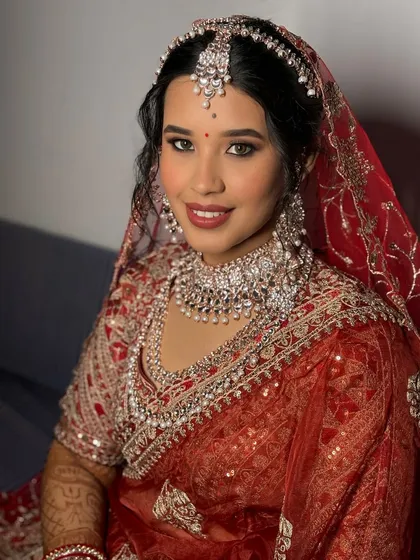 A close-up showcasing the diamond jewelry and complementary makeup. The cool tones in the makeup perfectly match the sparkle of her accessories.