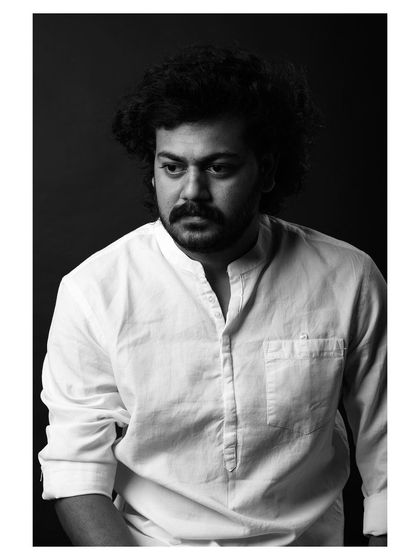 A strong and character-driven black and white portrait of an actor. The lighting is dramatic, highlighting his features and creating a compelling headshot.