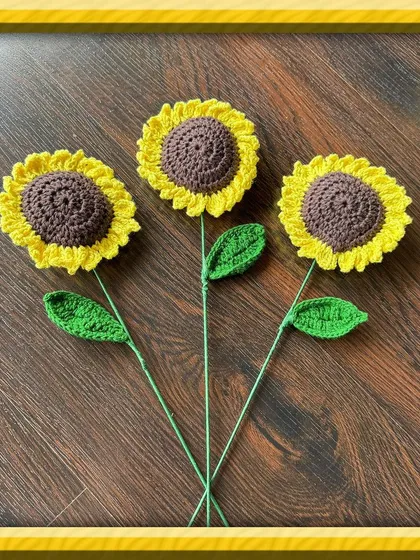 Here are three of my single-stem crochet sunflowers, each crafted with bright yellow petals and a detailed brown center. These are great for creating your own custom arrangement or as a simple, cheerful gift that won't wilt.