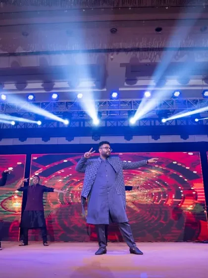 The groom and his backup dancers owning the stage with a high-energy performance. We can arrange for professional dancers to accompany your acts.