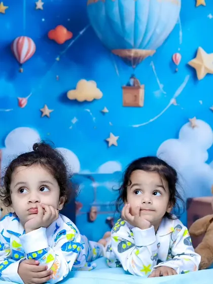 A fun pajama party for two siblings in our teddy bear and clouds themed studio.
