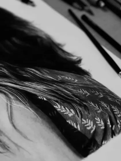 A detail shot showcasing the intricate pattern on the client's clothing.