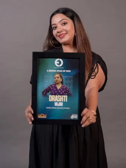 Holding my 'Rising Star of 2025' award from Entertainer's Connect. It's an honor to be recognized as an emerging force in the global emcee community.