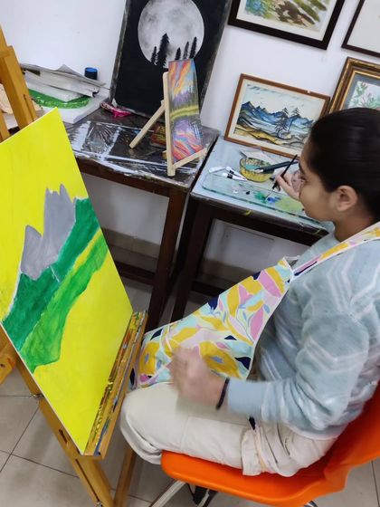 Follow a student's progress on a vibrant landscape painting, showing the development from a simple sketch to a fully colored and detailed scene.