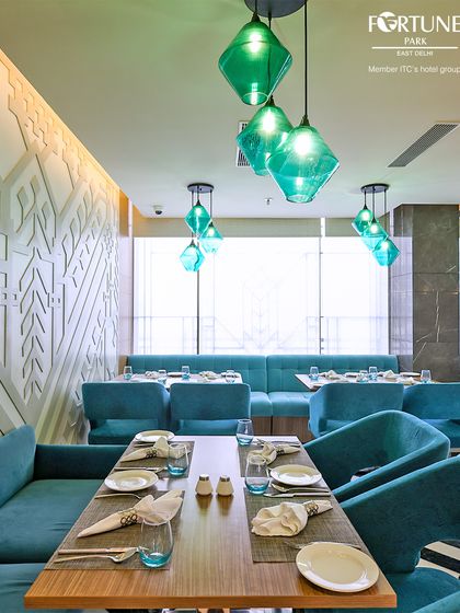 The long, comfortable booth seating along the window at Zodiac is perfect for larger groups or families dining together.