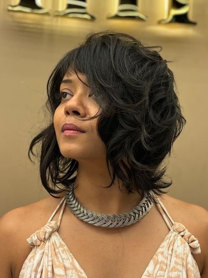 Another angle of a chic, textured short haircut. This look is all about embracing a bold and confident style.