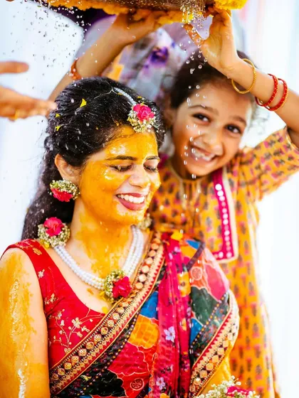 The beautiful chaos and happiness of a Haldi ceremony. This image captures the genuine smiles and traditions that make this pre-wedding event so special.