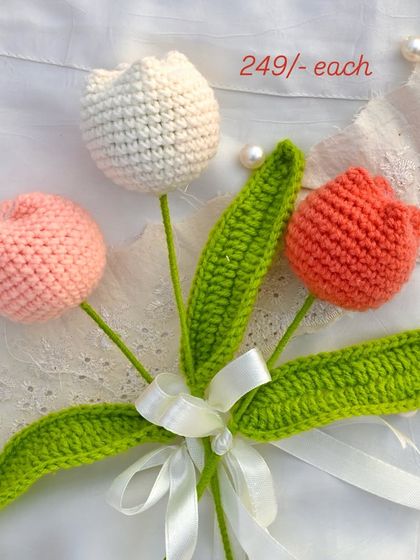 A lovely trio of crochet tulips in white, pink, and coral. These single stems are perfect for creating your own small arrangement.