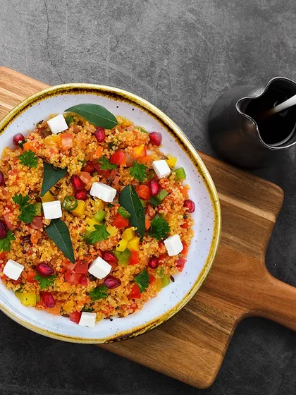 Our Grilled Vegetable Couscous Upma is a colorful and all-time breakfast favorite. Served with Indian green chutney, it's a healthy and delicious way to start your day.