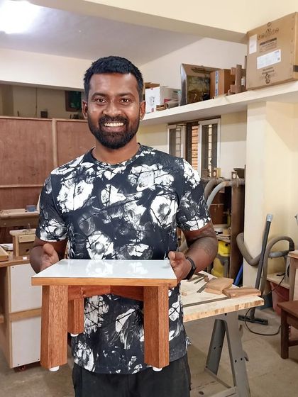 Vivek with the small table he built during his two-day introduction to woodworking with hand tools.