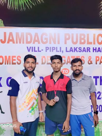 With my player who secured a bronze medal and qualified for the Nationals in athletics.