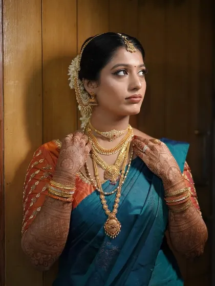 Adjusting the layered necklaces is a key part of getting ready. I work with the bride to ensure her makeup and jewelry are perfectly in place for a flawless final look.