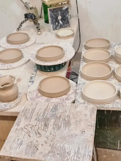 More works in progress at the studio. These plates have been thrown on the wheel and are now drying, waiting for the next steps of trimming, firing, and glazing.