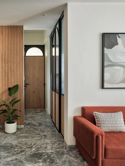 Experience the art of contemporary living in Apartment 1101. The Italian marble flooring, warm paneled walls, and elegant dining area invite you into a world of stylish comfort.