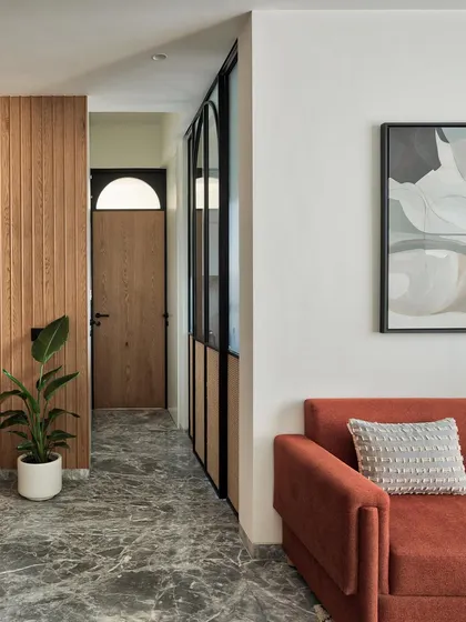 Experience the art of contemporary living in Apartment 1101. The Italian marble flooring, warm paneled walls, and elegant dining area invite you into a world of stylish comfort.